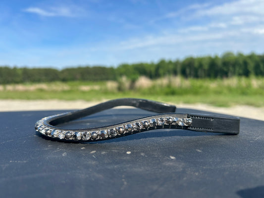 A black sparkly English leather browband with silver, black and clear crystals.
